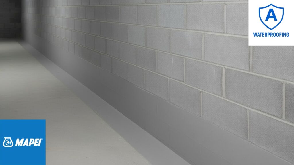 waterproofed-block-wall-with-mapei-planiseal-mr Waterproofed block wall showing Mapei Planiseal MR applied two blocks up from the floor and extending 200 mm onto the concrete floor surface.