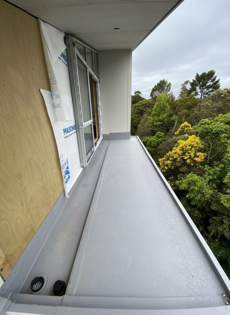 New TPO membrane waterproofing installed on Auckland balcony as modern replacement for old butynol roof system